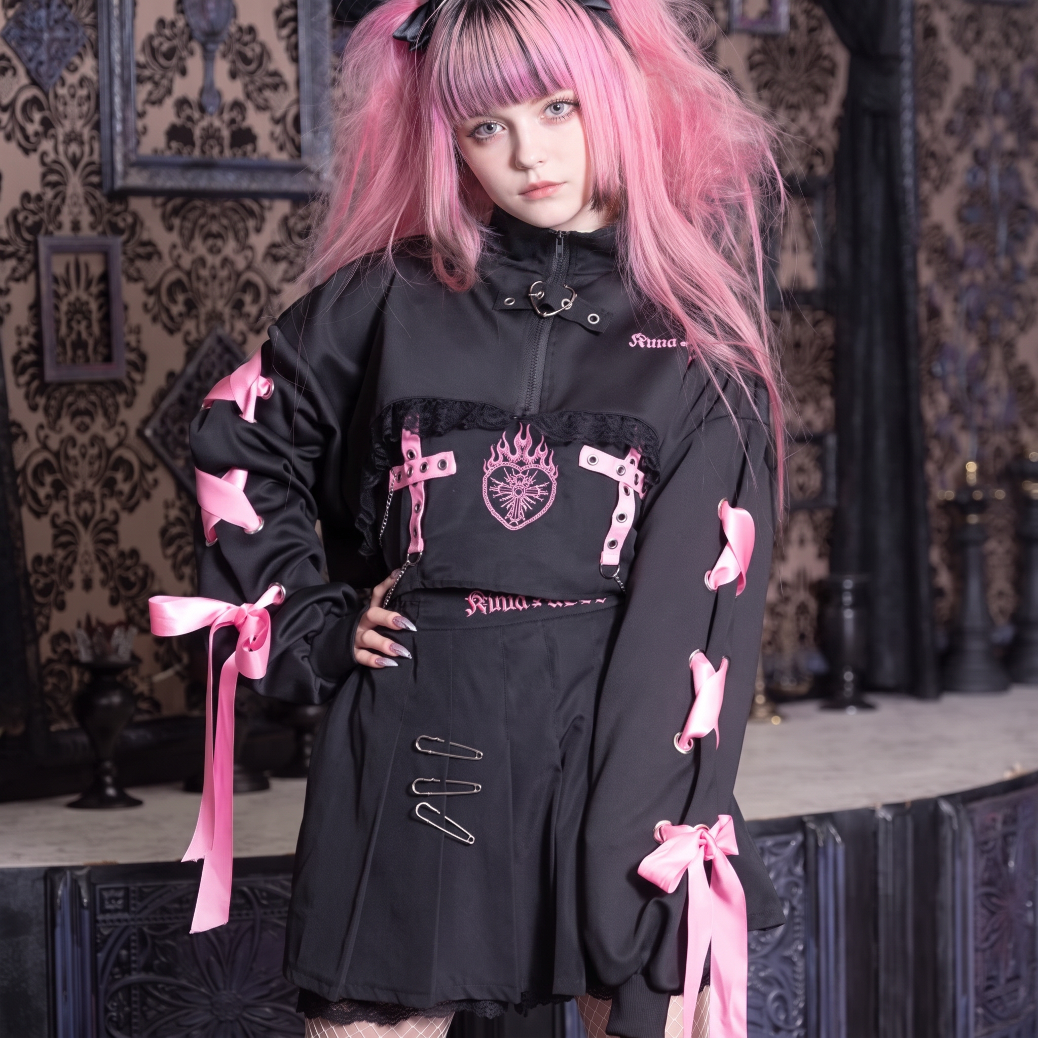 The laced half-zip set: a cropped black half-zip laced with pink ribbon over a pinned wrap skirt.